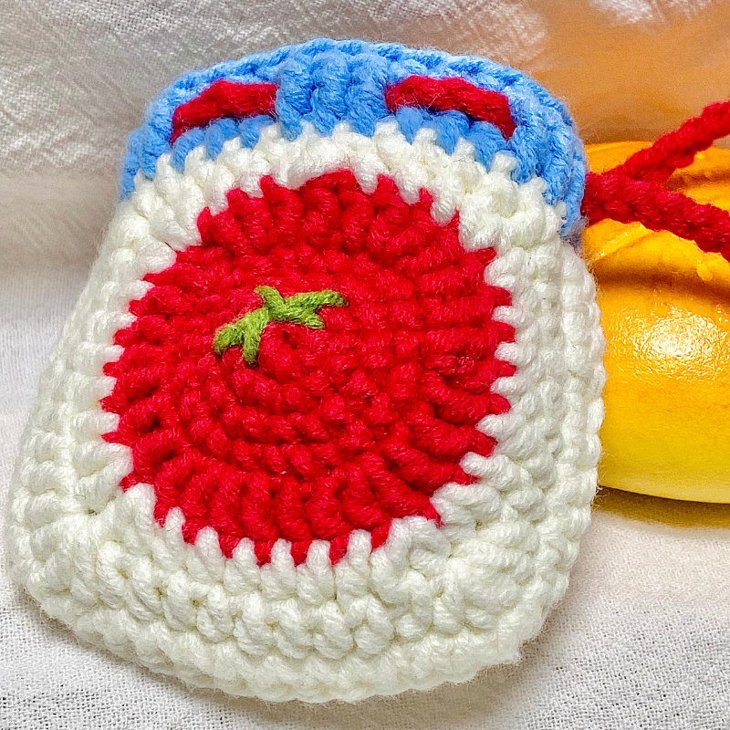 Crocheted red tomato Bluetooth earphone bag